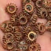 Lot of 125 5mm copper wire saucer beads. 5513