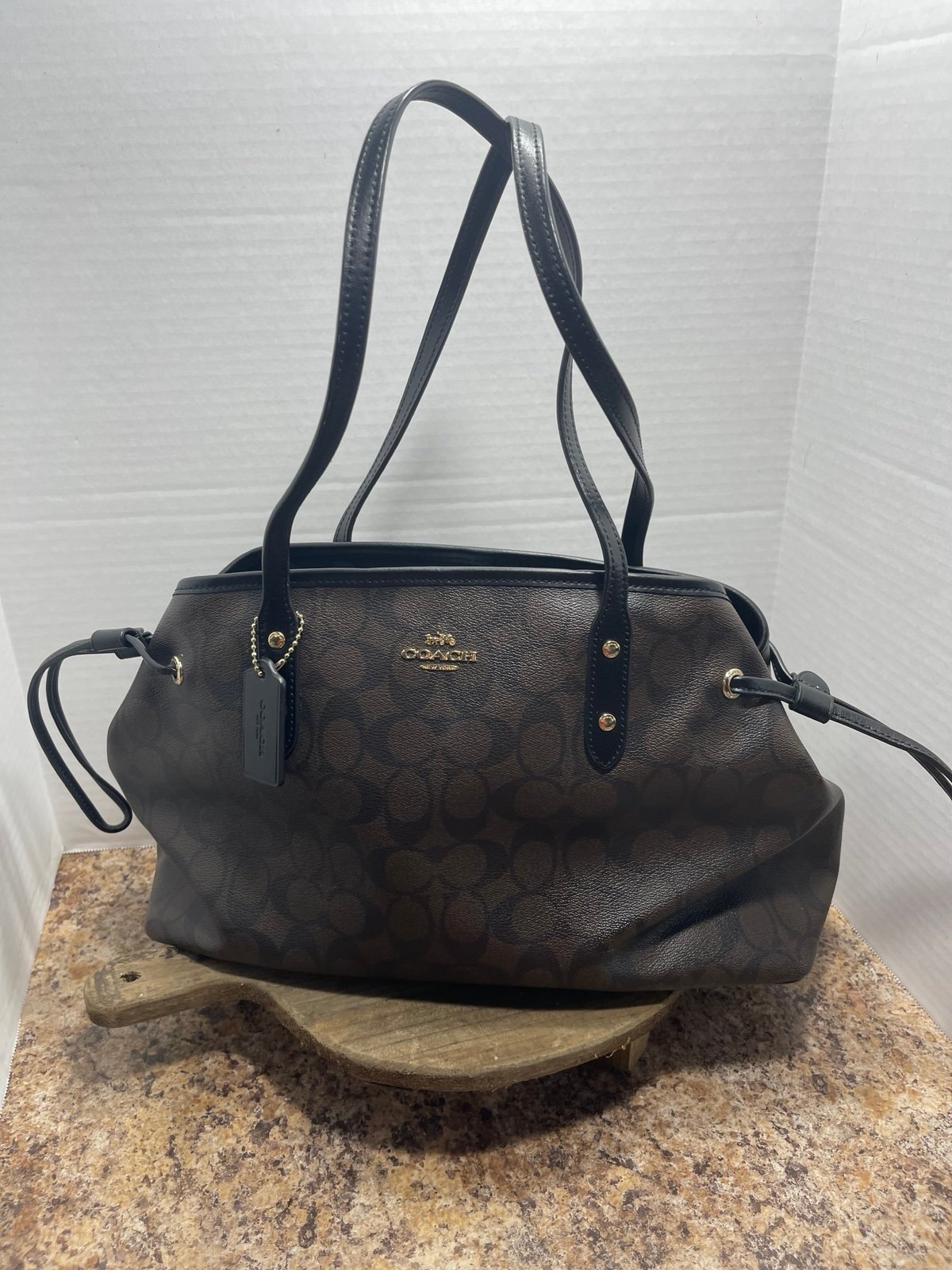 Coach drawstring signature carryall bag style F57842 with dust bag