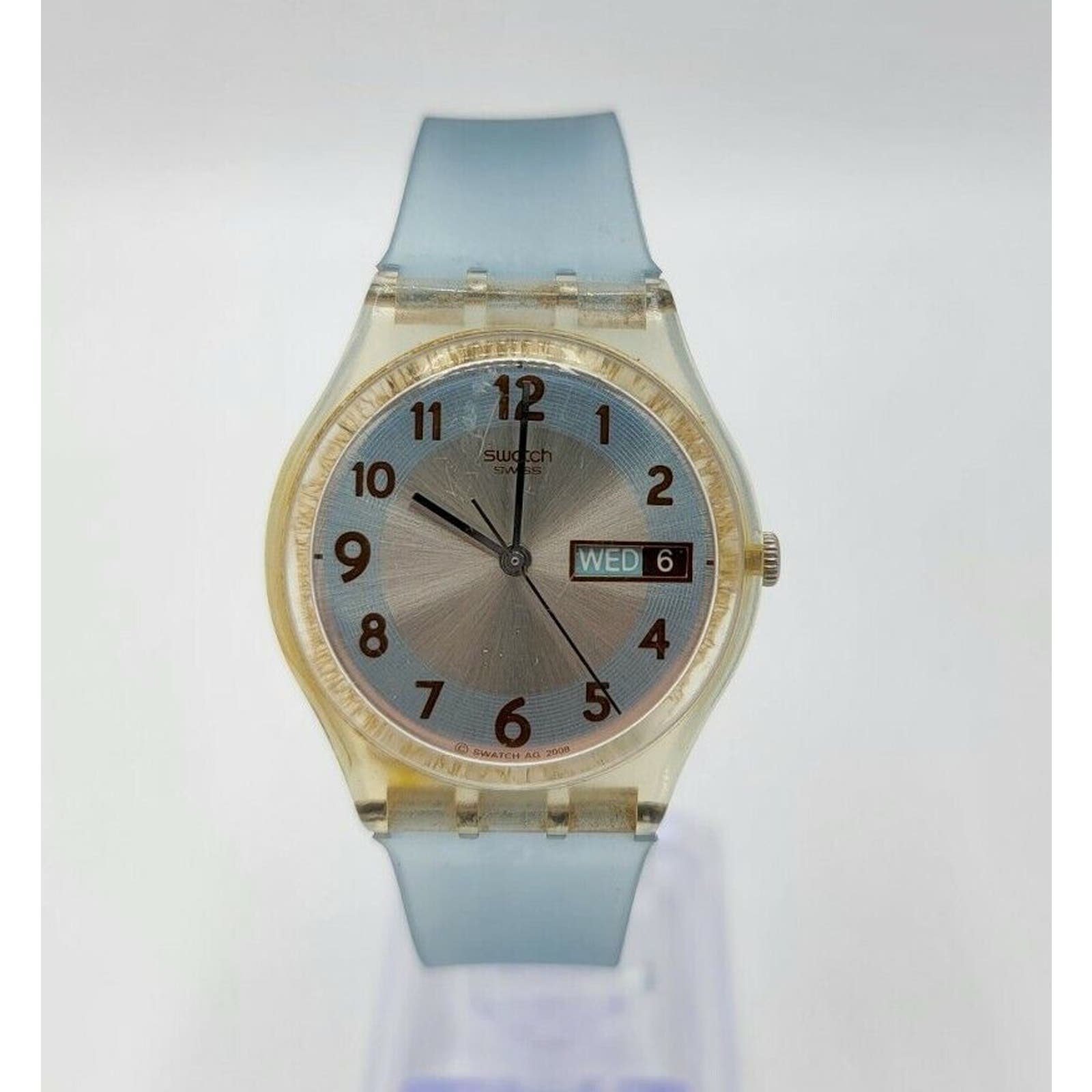 Swatch 2008 Transparent Light Blue Silver Brown 34mm Day/Date Swiss Quartz Watch