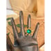 Adjustable gold tone ring with large green stone