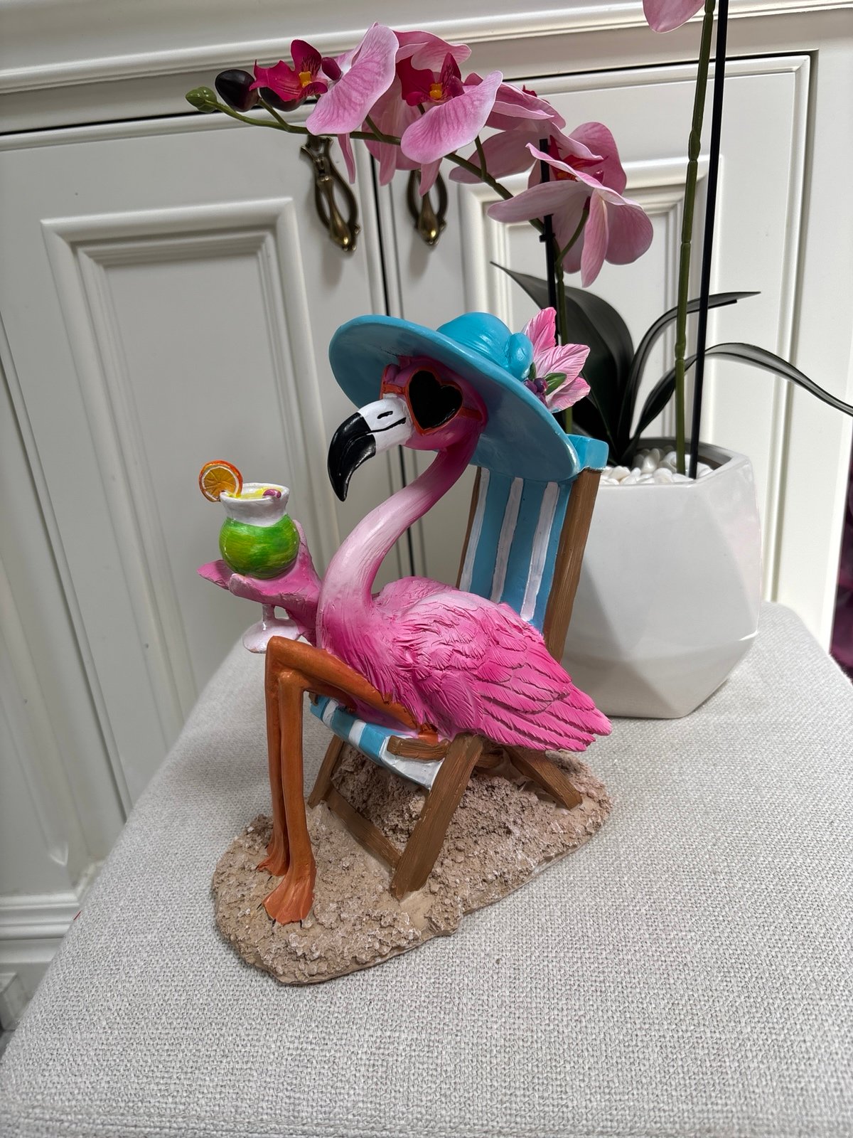 Flamingo on a Beach Chair with a cocktail decor.