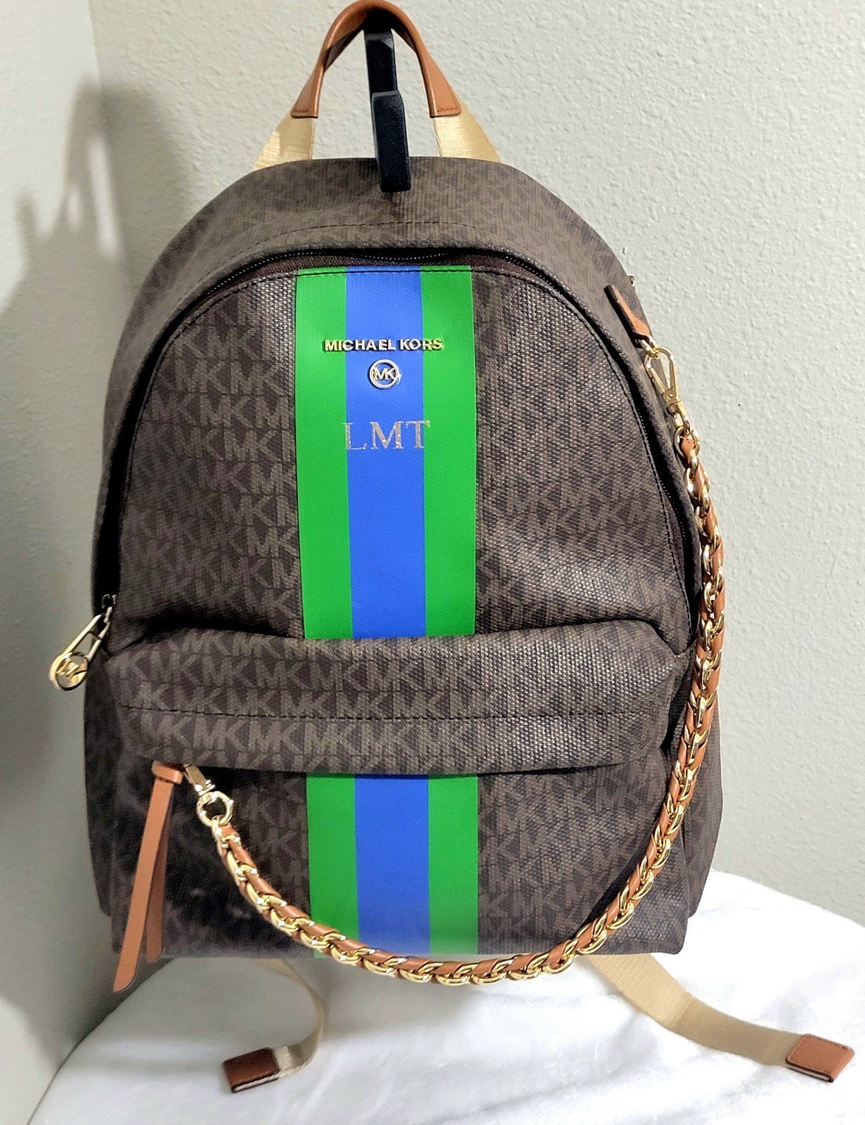 Michael Kors Slater medium signature logo stripe backpack. Item#50