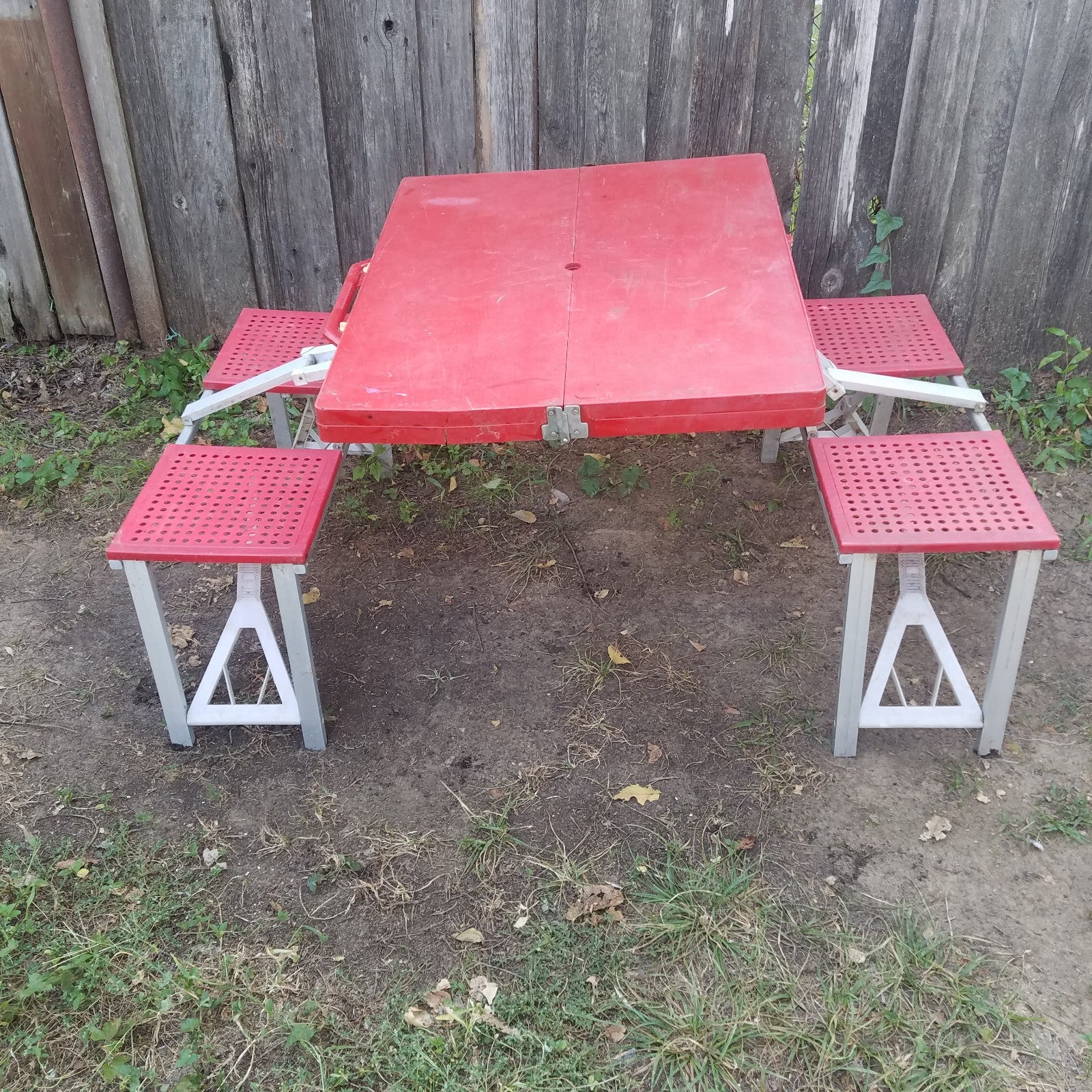 Portable folding table with 4 seats.