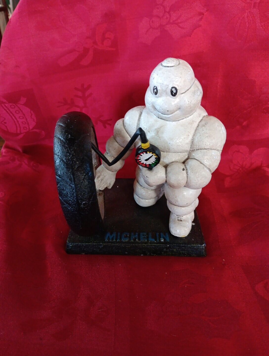 Michelin Man Pumping Tire Cast Iron Statue
