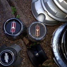 2 Oldsmobile Cutlass center caps