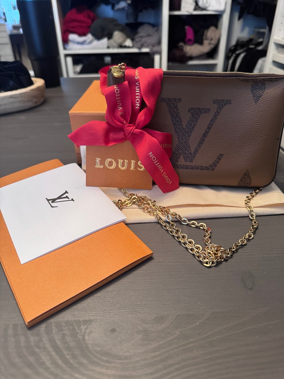 Louis Vuitton double pochette w/ gold chain. Comes with receipt, box and duster