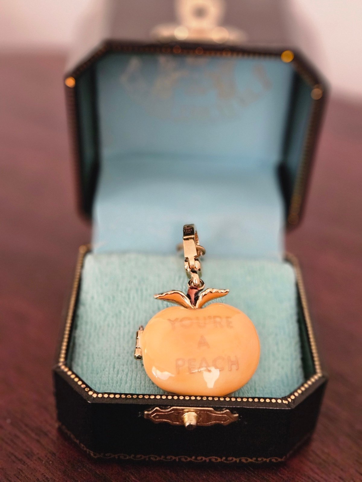 Juicy Couture you’re a peach charm