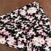 Momper Pleated Nursing & Maternity romper in vibrant tie dye.