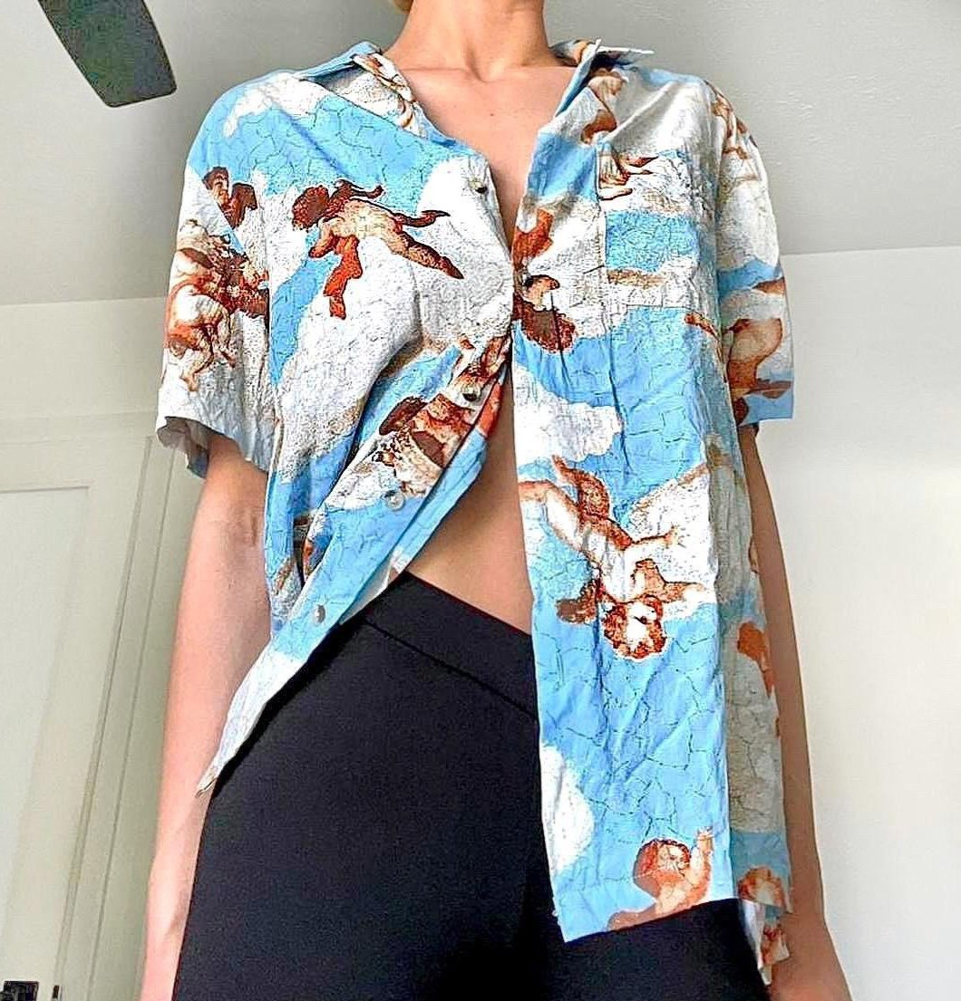 URBAN OUTFITTERS LIGHT BLUE ALL OVER ANGEL/CHERUB BUTTON UP TOP