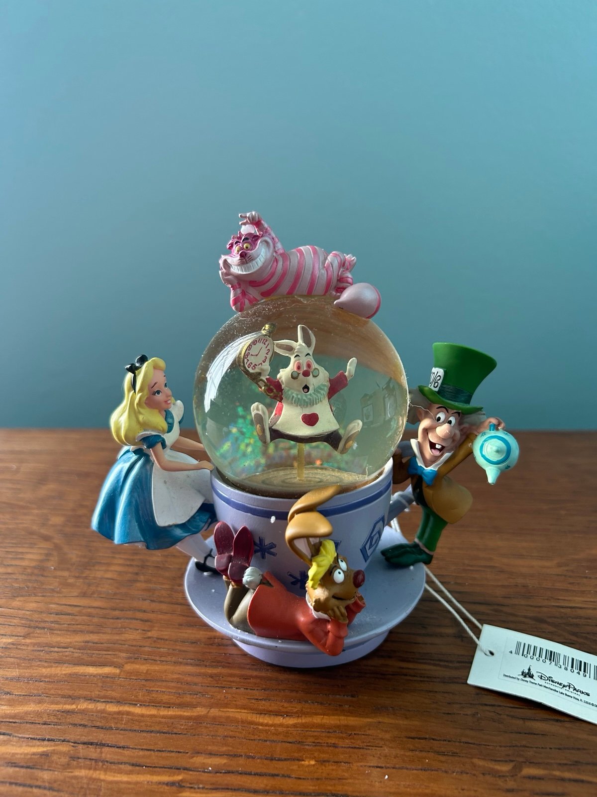 Disney Alice In Wonderland spinning tea cup snow globe New in Box