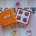 Le Creuset 4 Pieces of Orange Plastic Round Pot Bumpers Pins Clips Set Authentic