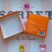 Le Creuset 4 Pieces of Orange Plastic Round Pot Bumpers Pins Clips Set Authentic