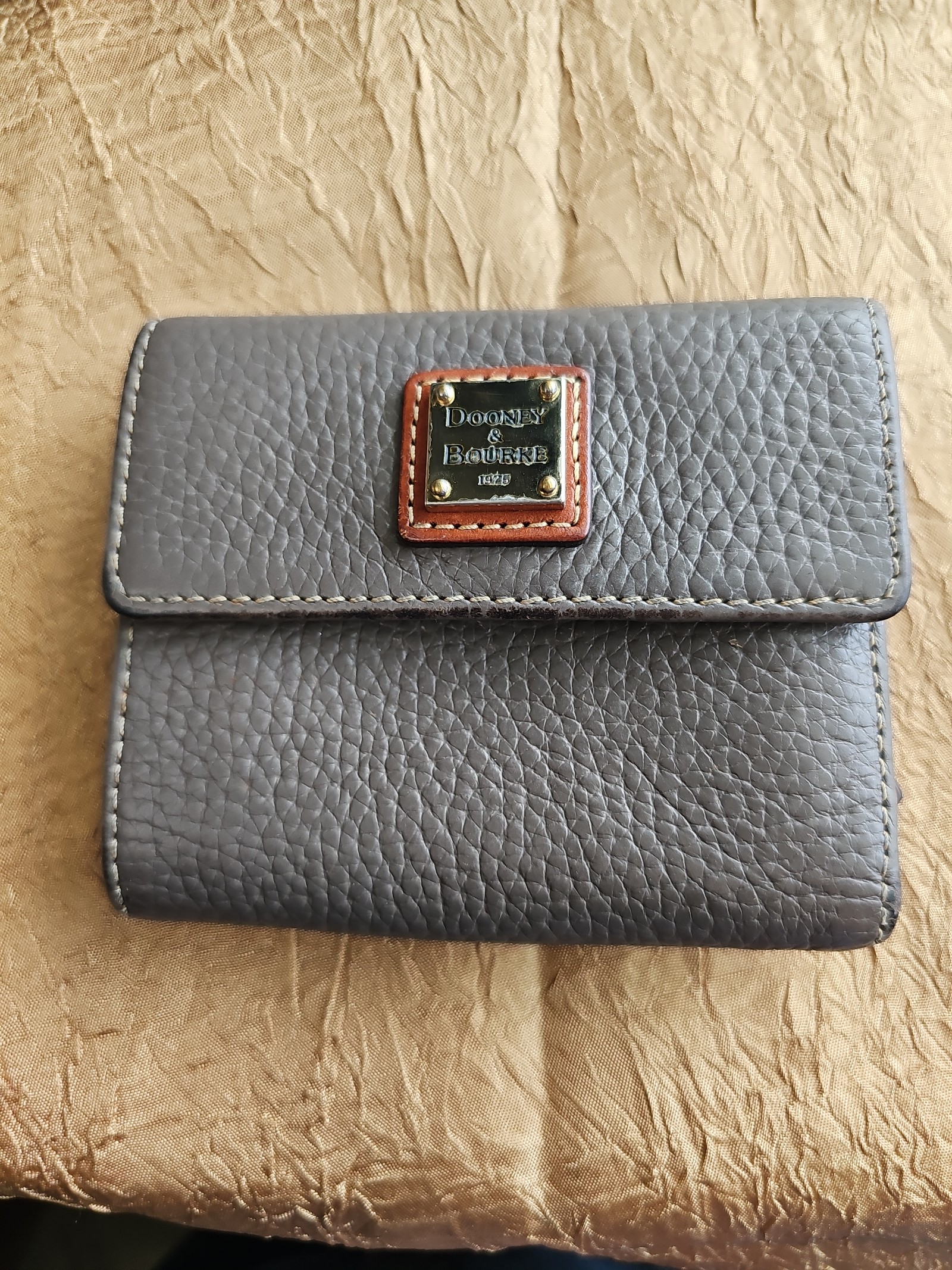 Dooney and Bourke pebbled leather tri-fold wallet gray