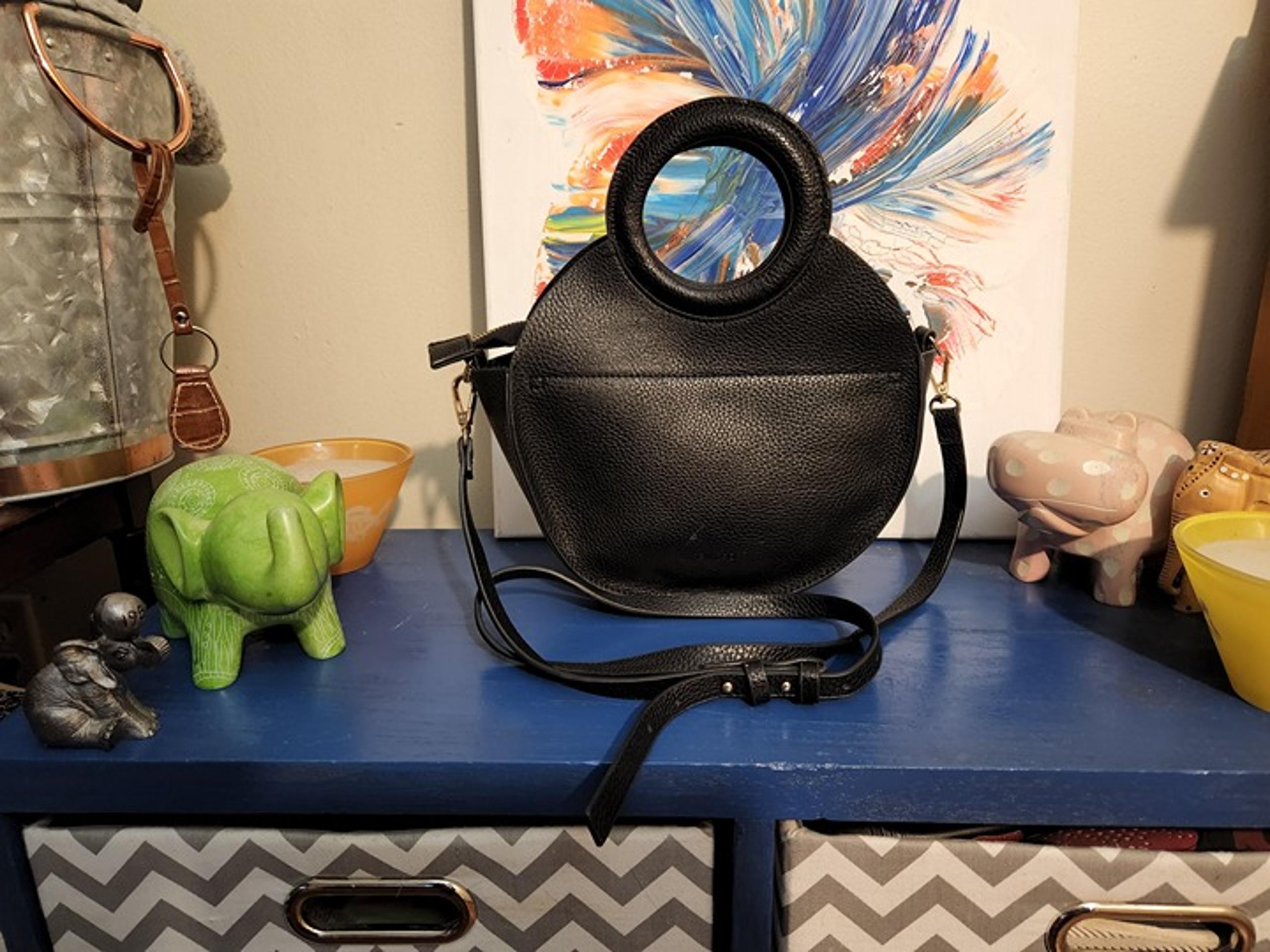 Small REMI|REID black faux leather Ali round crossbody bag Anthropologie