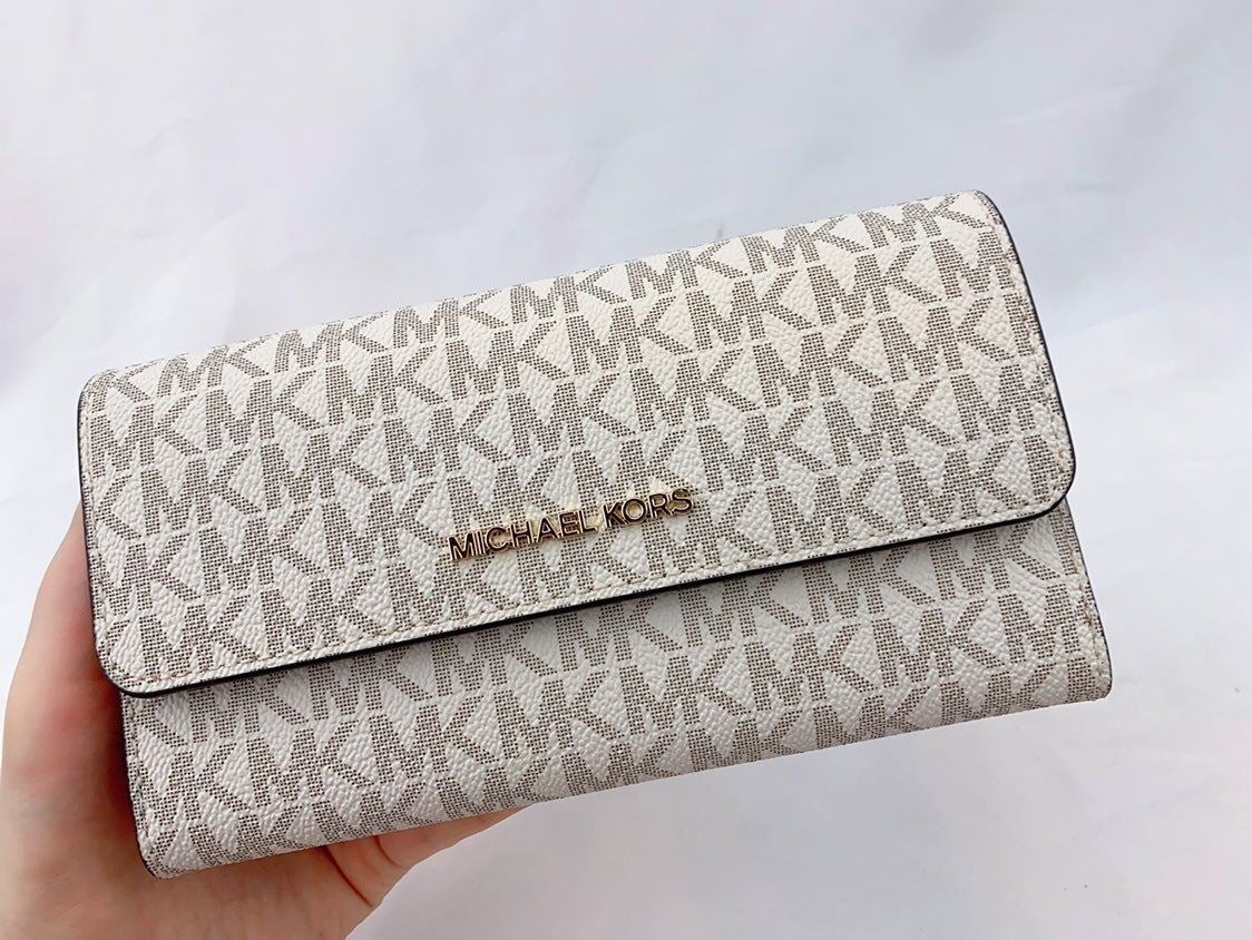 MK JST TRIFOLD WALLET VANILLA Logo