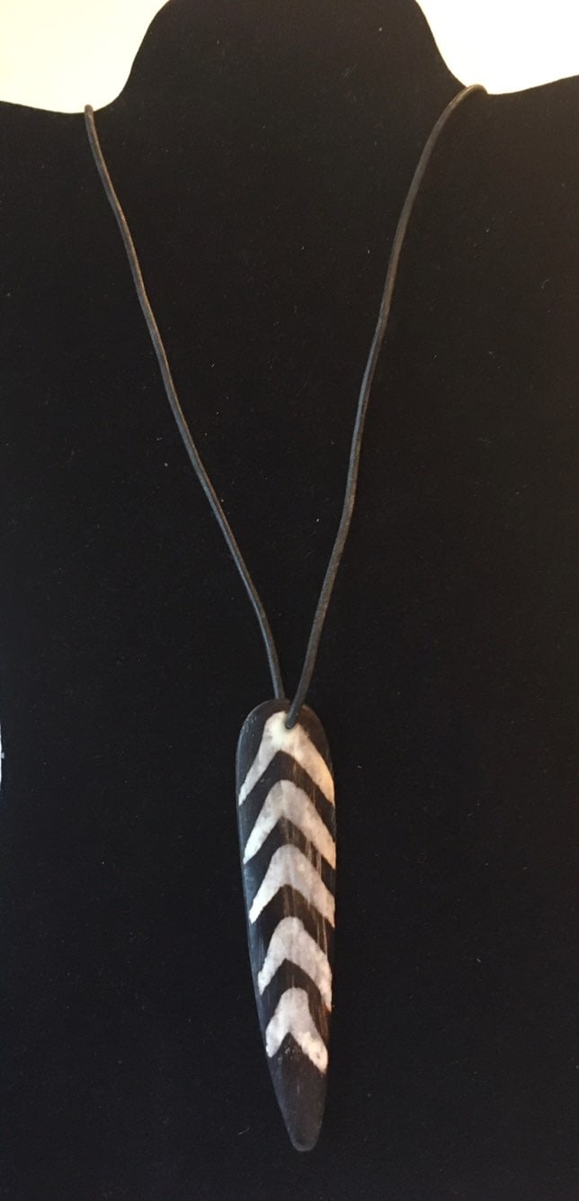 Spear necklace pendant has a spear that