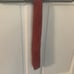 Hermes Light Red Silk Tie with Gray Belt Buckle Pattern