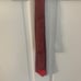 Hermes Light Red Silk Tie with Gray Belt Buckle Pattern