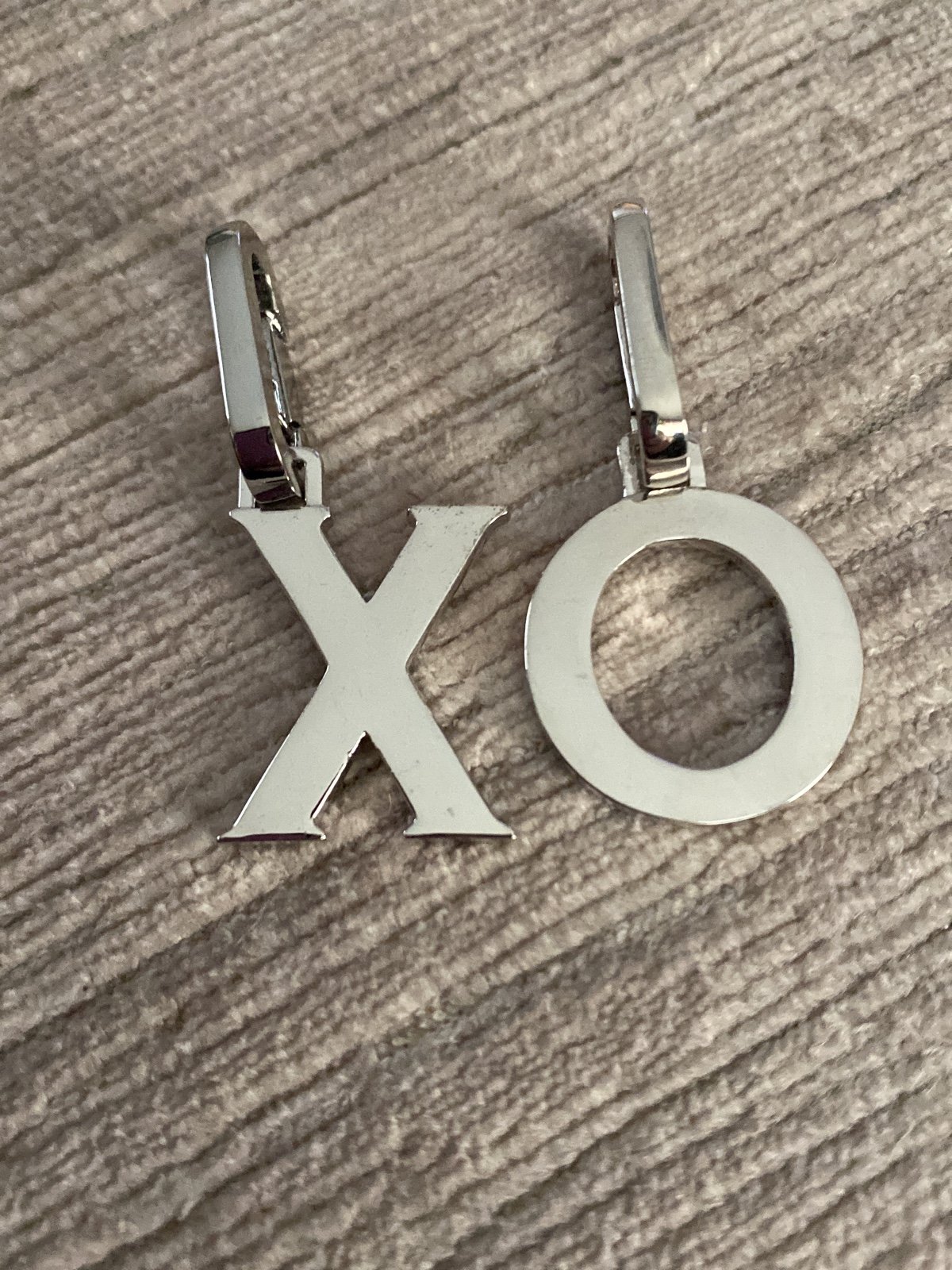Henri Bendel Silver Influencer XO charms. Brand new - never used