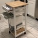 Solid Wood Frame Utility Cart with 4 Wire Fruit Baskets and Drawer, White