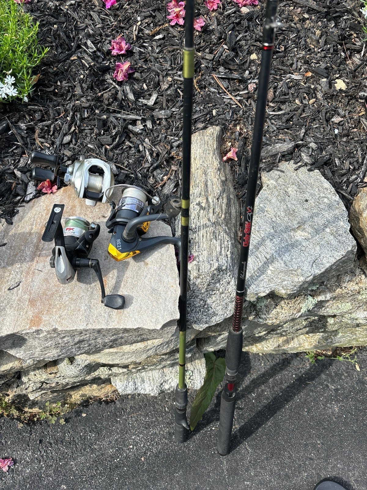 Assortment of reels and bait casting rods