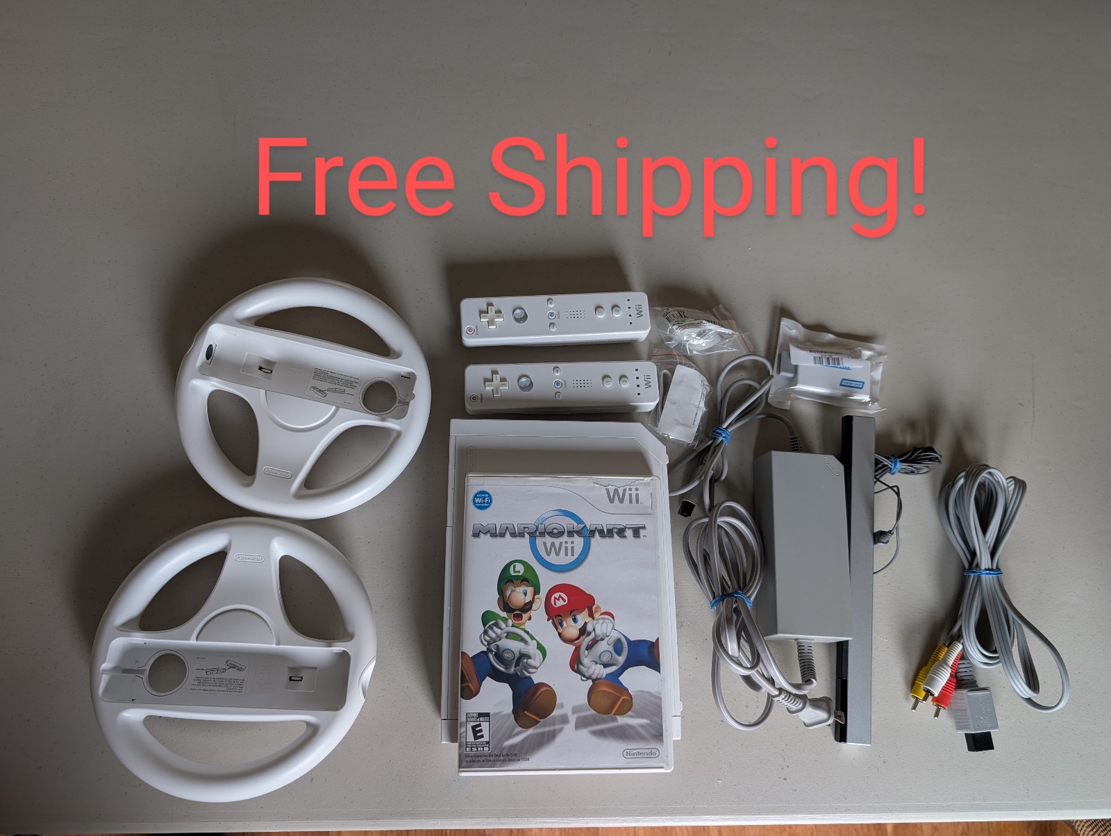 Nintendo Wii Console w/ Mario Kart, (2) Wiimotes + more