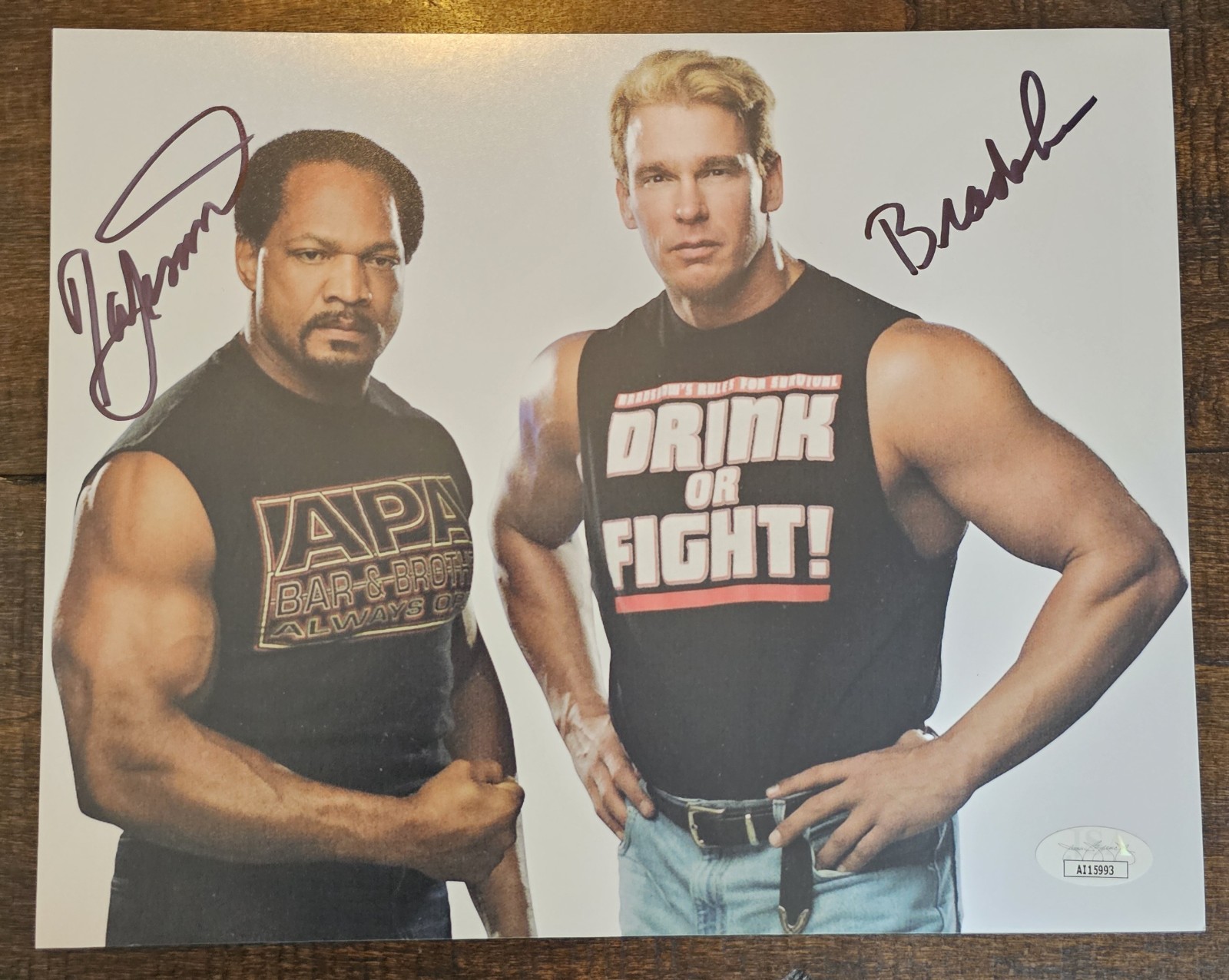 Ron Simmons and John Bradshaw signed APA WWE 8x10. Comes with JSA Authentication