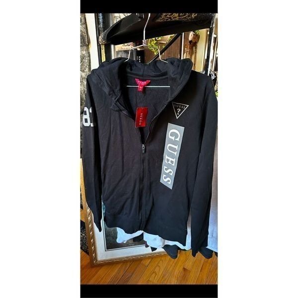 Guess logo zip up hoodie new with tags says size 16, but I believe it’s junior 1