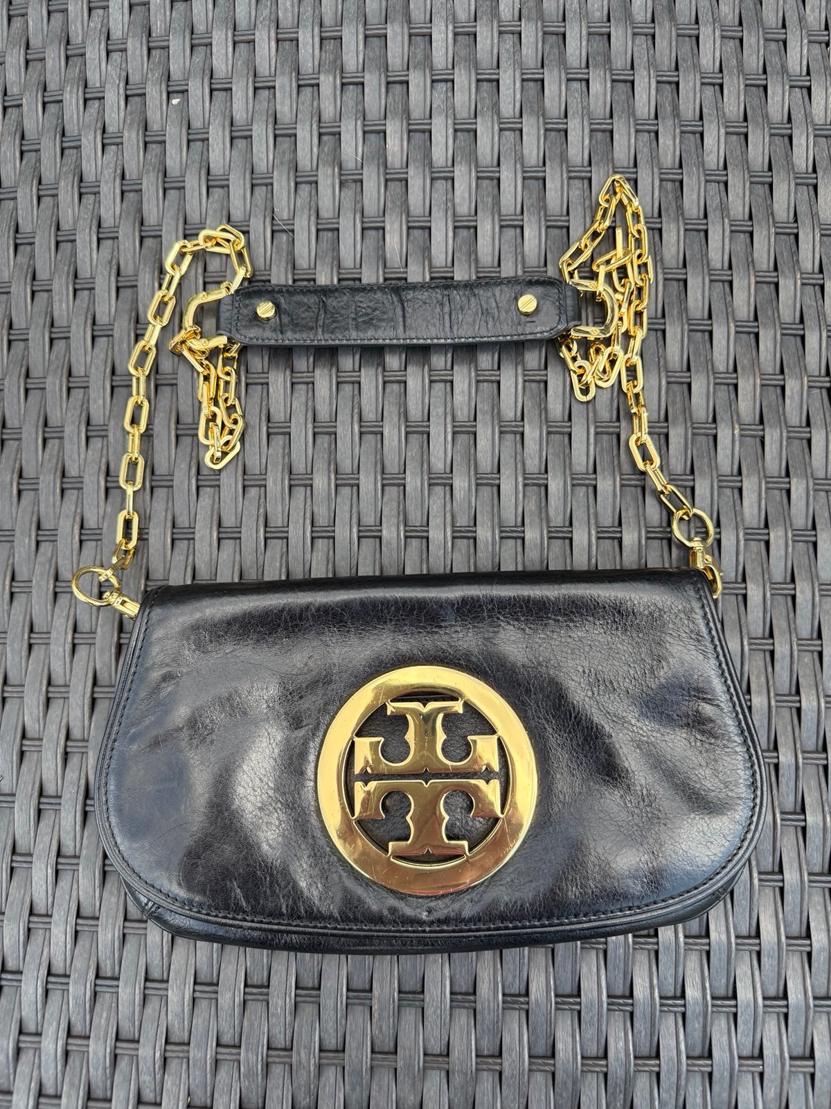 Tory Burch black leather crossbody bag featuring an adjustable Black Like New