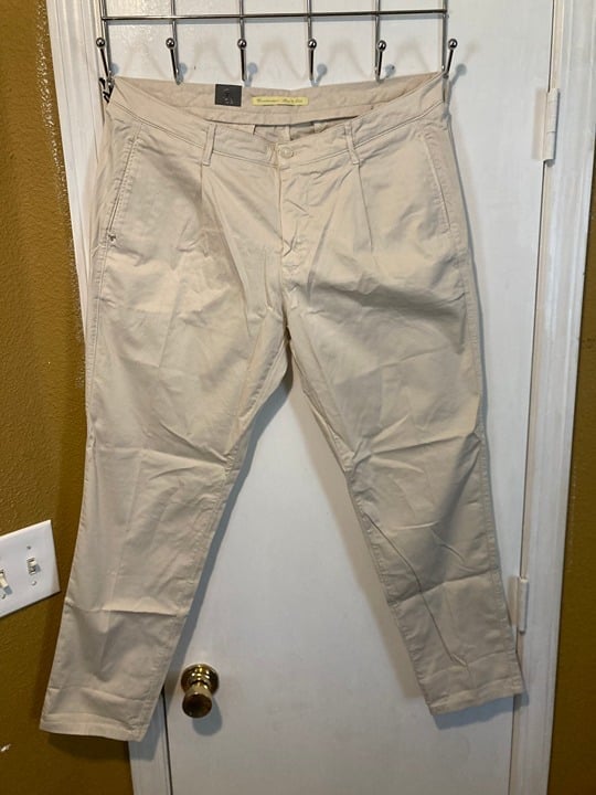 Zero Construction women's size 34 light tan pleated front slim fit trouser pants
