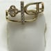 14 k solid yellow gold ring with white CZ