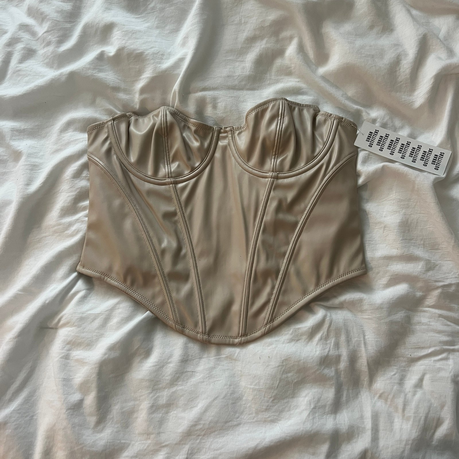 Urban outfitters faux leather corset top Size medium Condition: NWT Color: iv