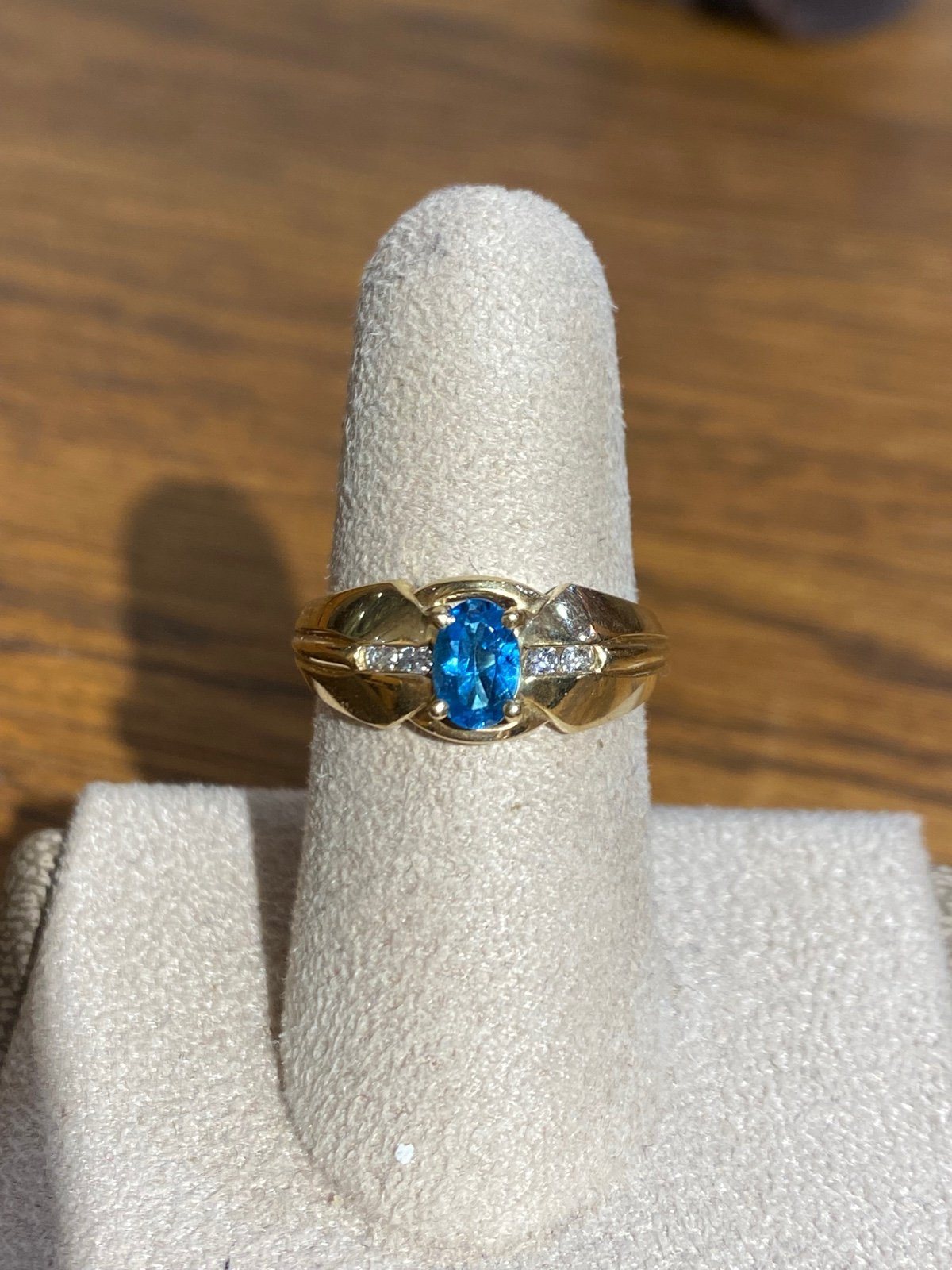 Ladies 10k gold blue topaz and diamond ring