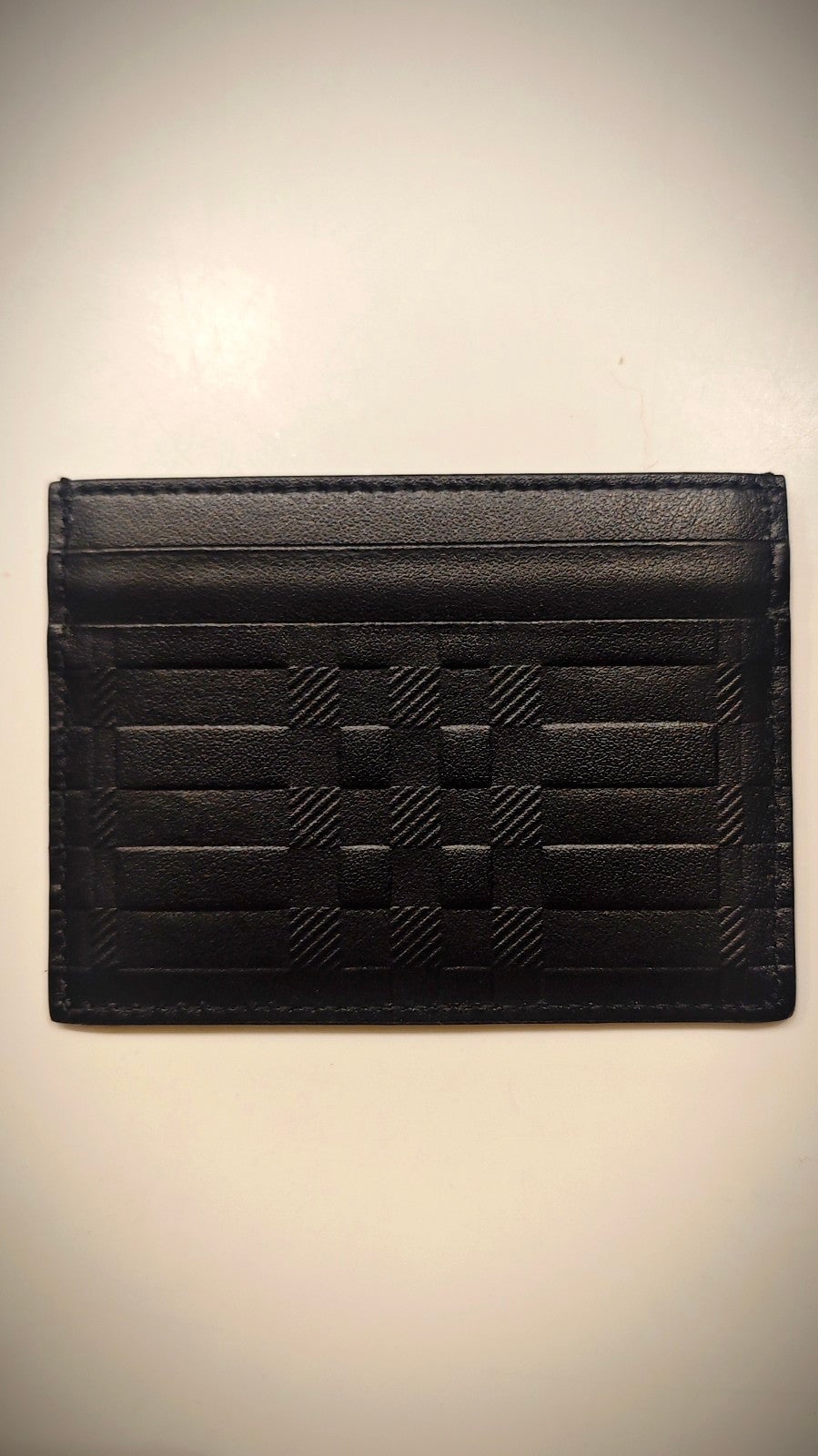 Burberry leather card case. New never used. Measures 4 x 3 .