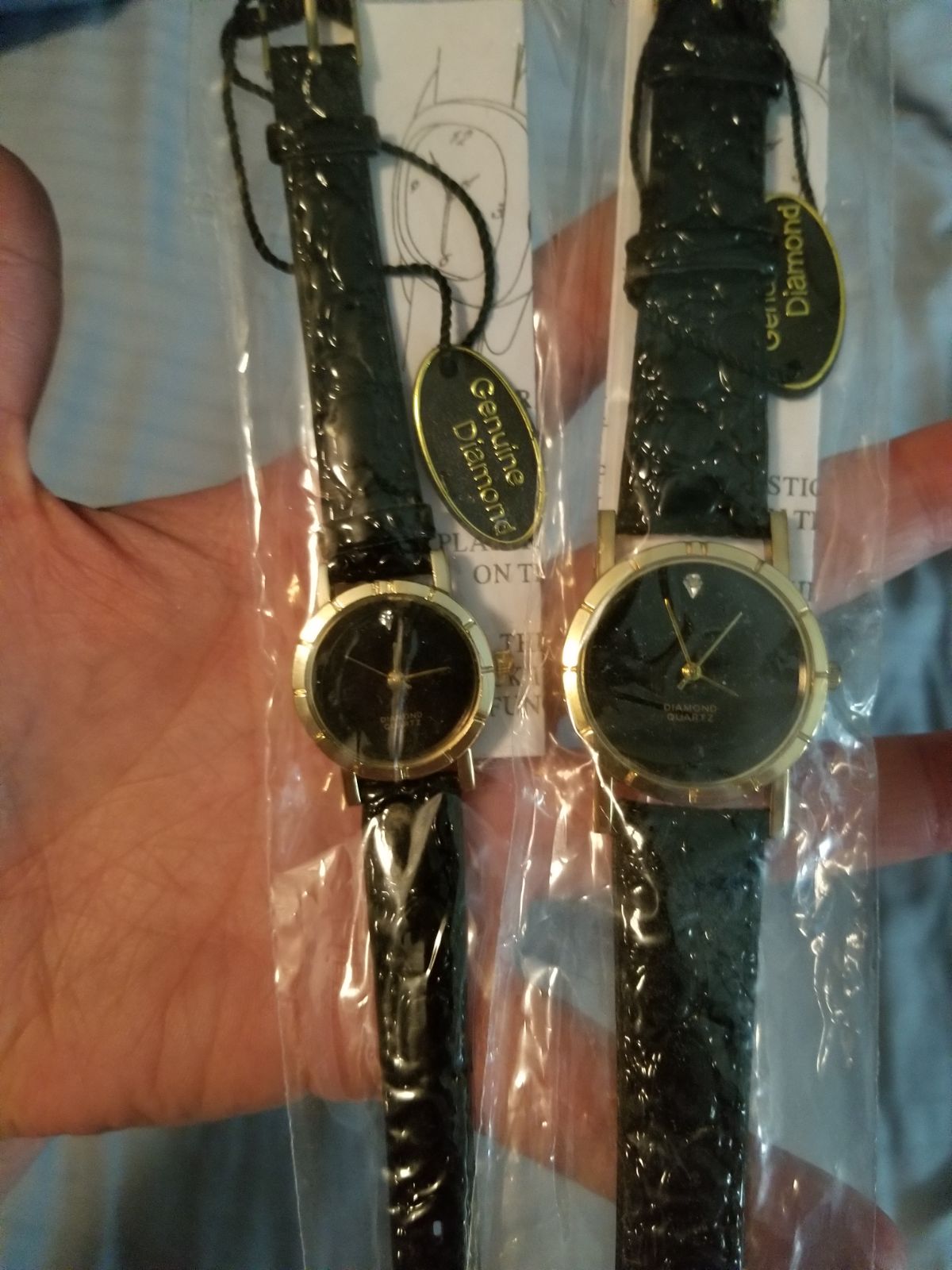 Pair Of Watches With Diamonds In Them.