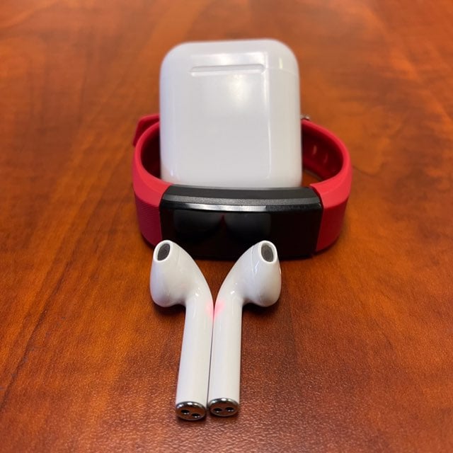 Pack of sport watch and earphones