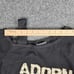 NWT INC Women's M Black Varsity Wt Pearl ADORN Asymmetrical Long Sleeve Sweater