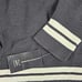 NWT INC Women's M Black Varsity Wt Pearl ADORN Asymmetrical Long Sleeve Sweater