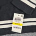 NWT INC Women's M Black Varsity Wt Pearl ADORN Asymmetrical Long Sleeve Sweater