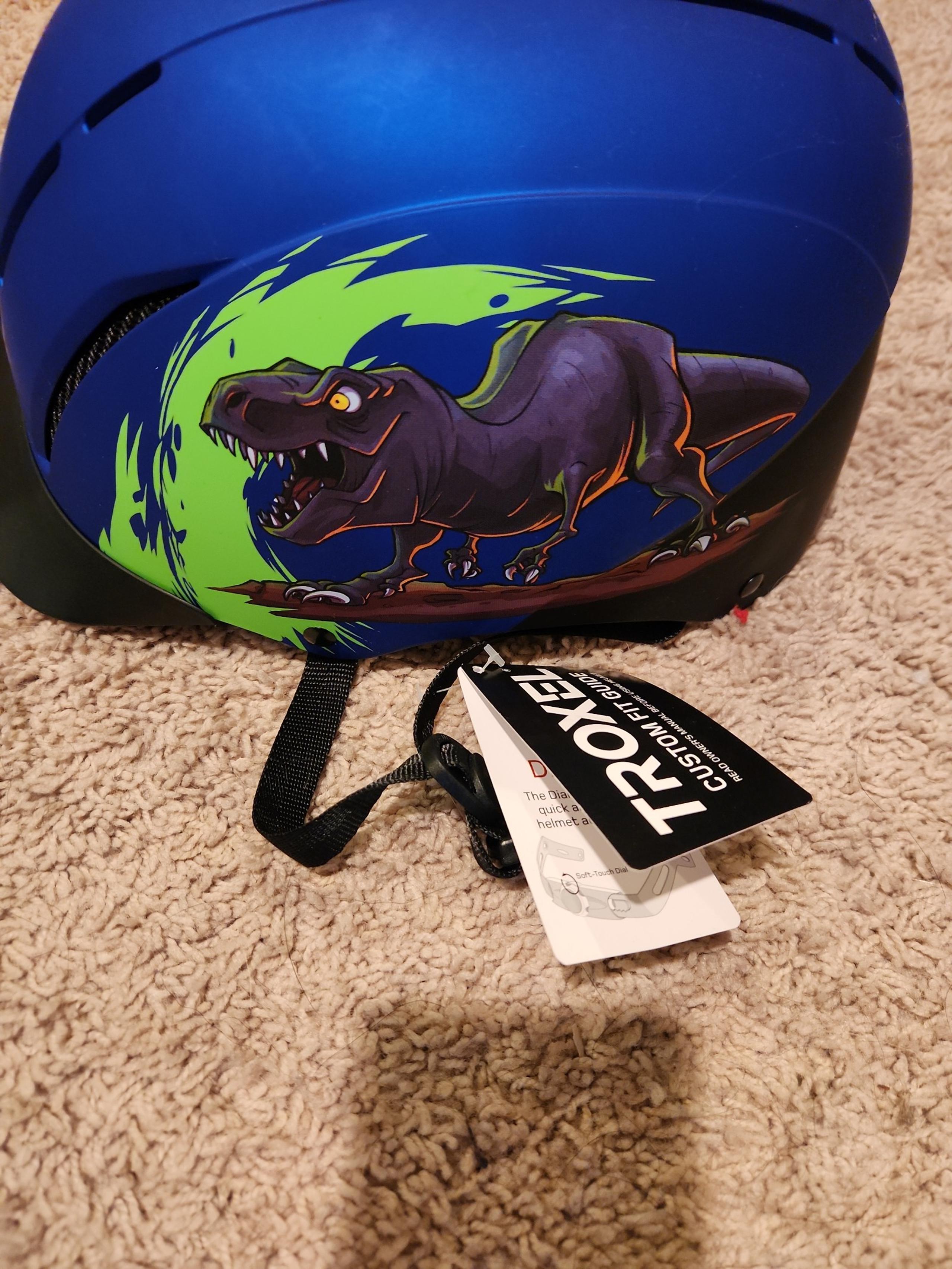 Troxel brand kids Horse Riding Helmet with T-Rex on it, blue in color
