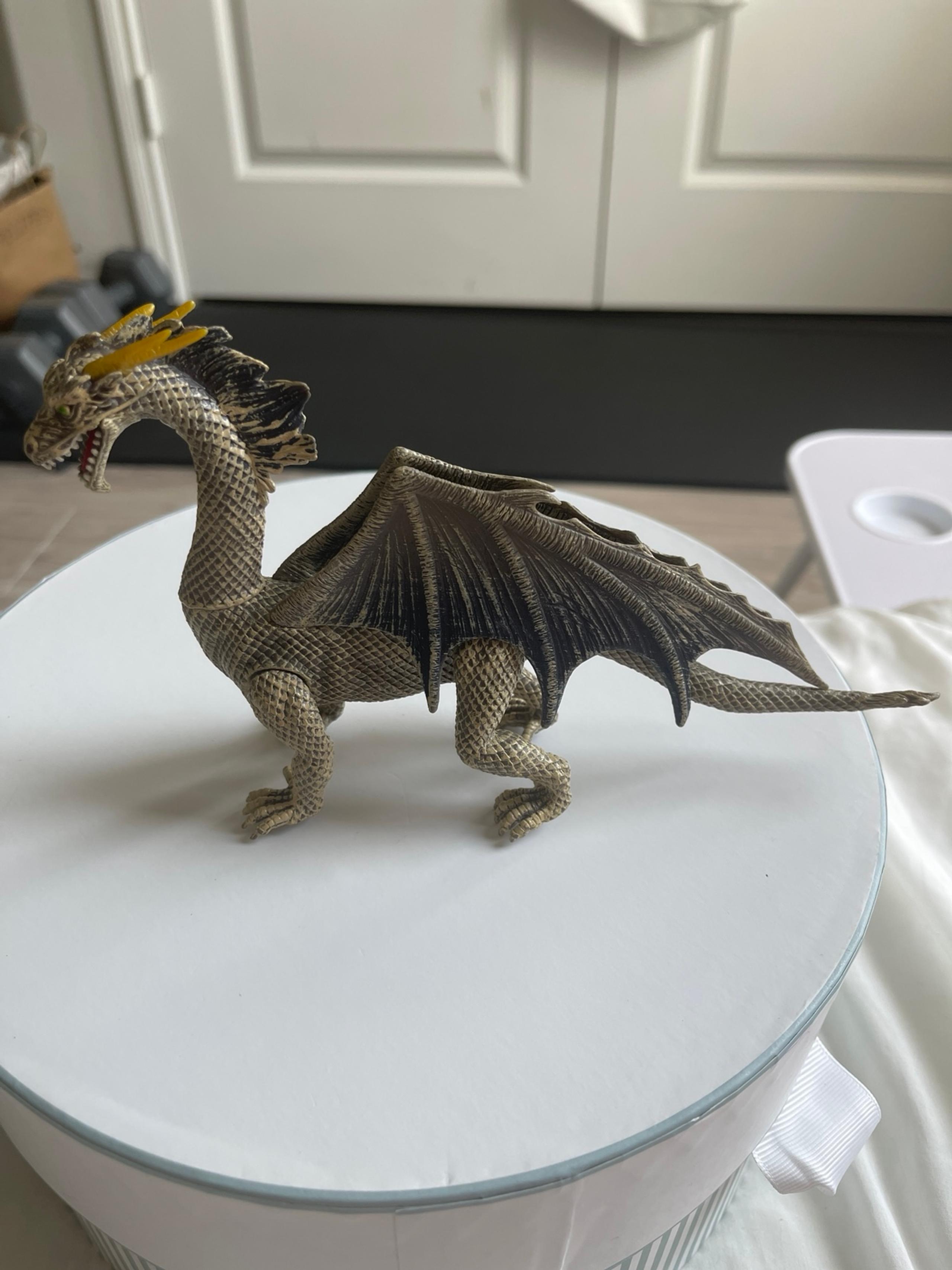 Kid Galaxy Poseable Dragon Action Figure, specifically a grey or brown-colored