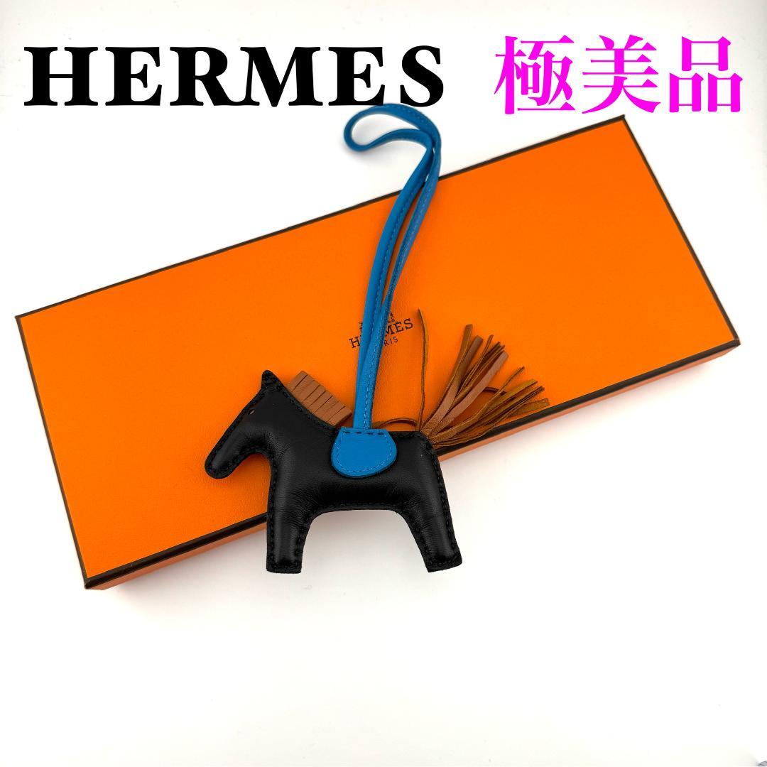 Hermes Rodeo Charm PM in Agneau Milo, Black and Gold.