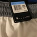 Numerous pairs of Nike shorts different