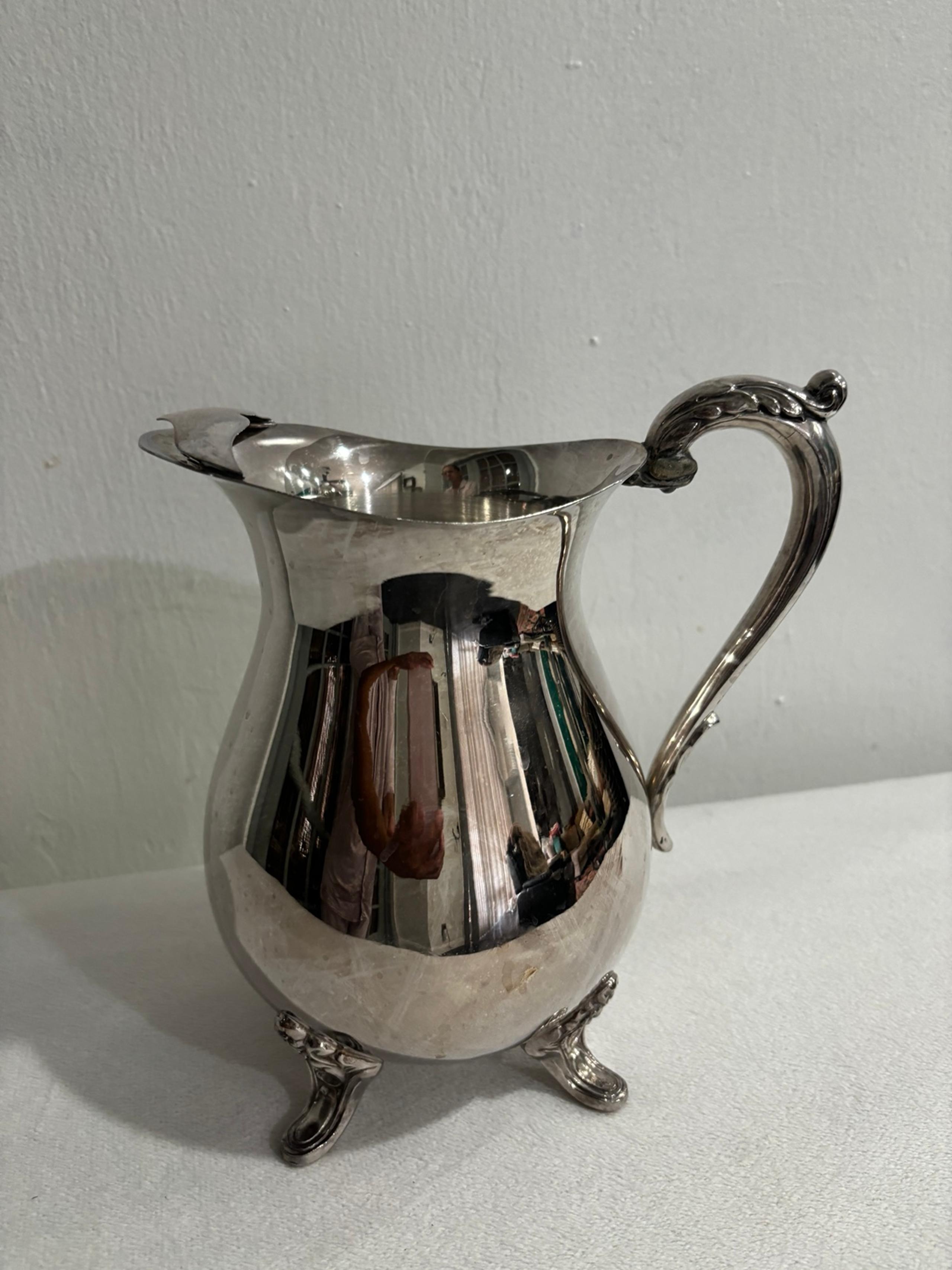 Vintage Towle silverplate pitcher with ice guard. Holds 8 cups