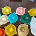 Vintage Plastic Manual Juicer Multicolor Reamer Farmhouse Kitchenware Lot of 17