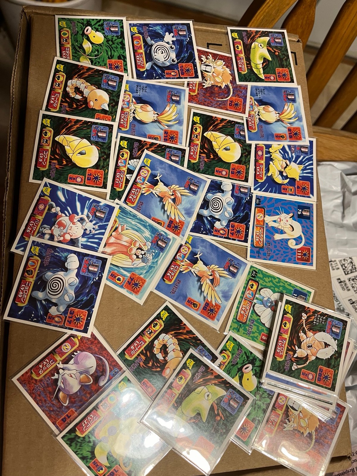 A lot of over 30 1997 Pokémon stickers