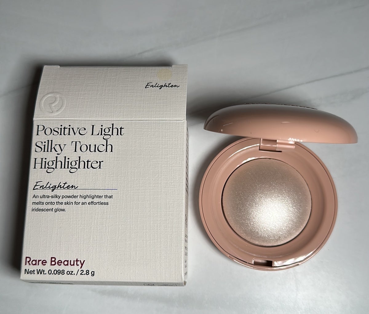 Rare beauty highlighter in Enlighten