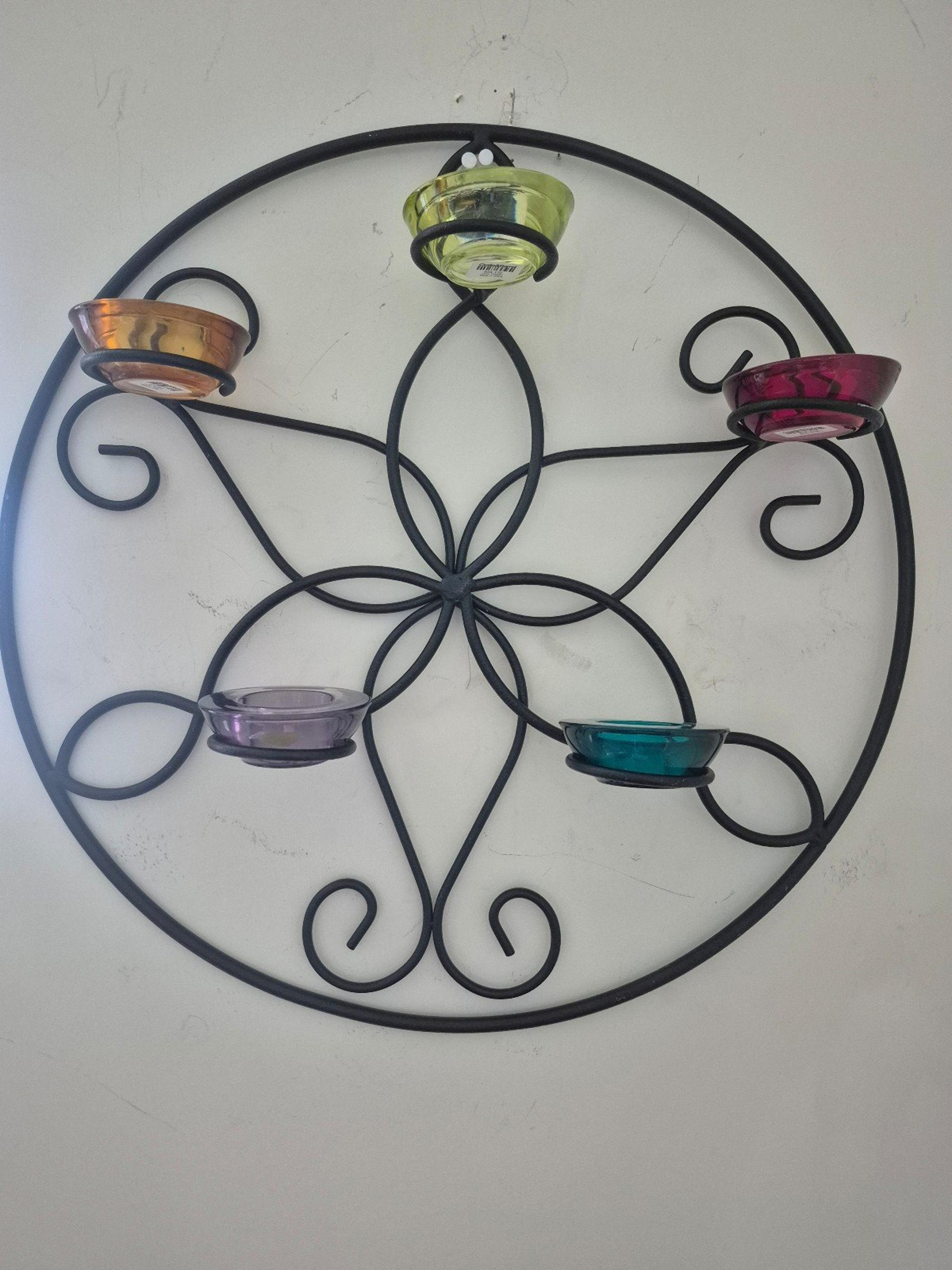 Wrought iron hanging wall sconce with 5 glass candle holders