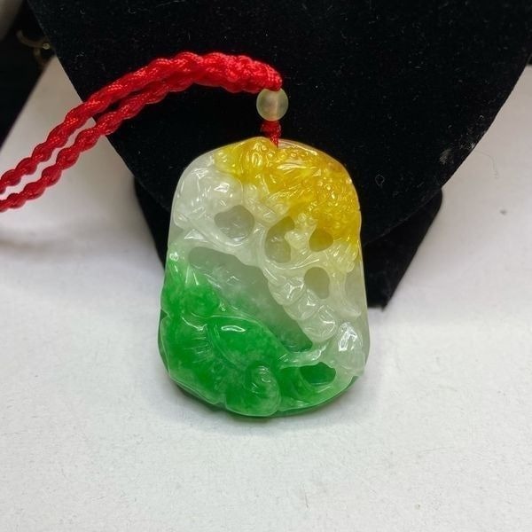 Beautiful tri colored carved jade pendant