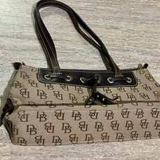Dooney and Bourke. New tassel zip top bag